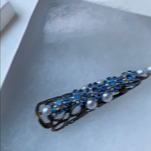 Hand designed Swarovski cone tip ring.